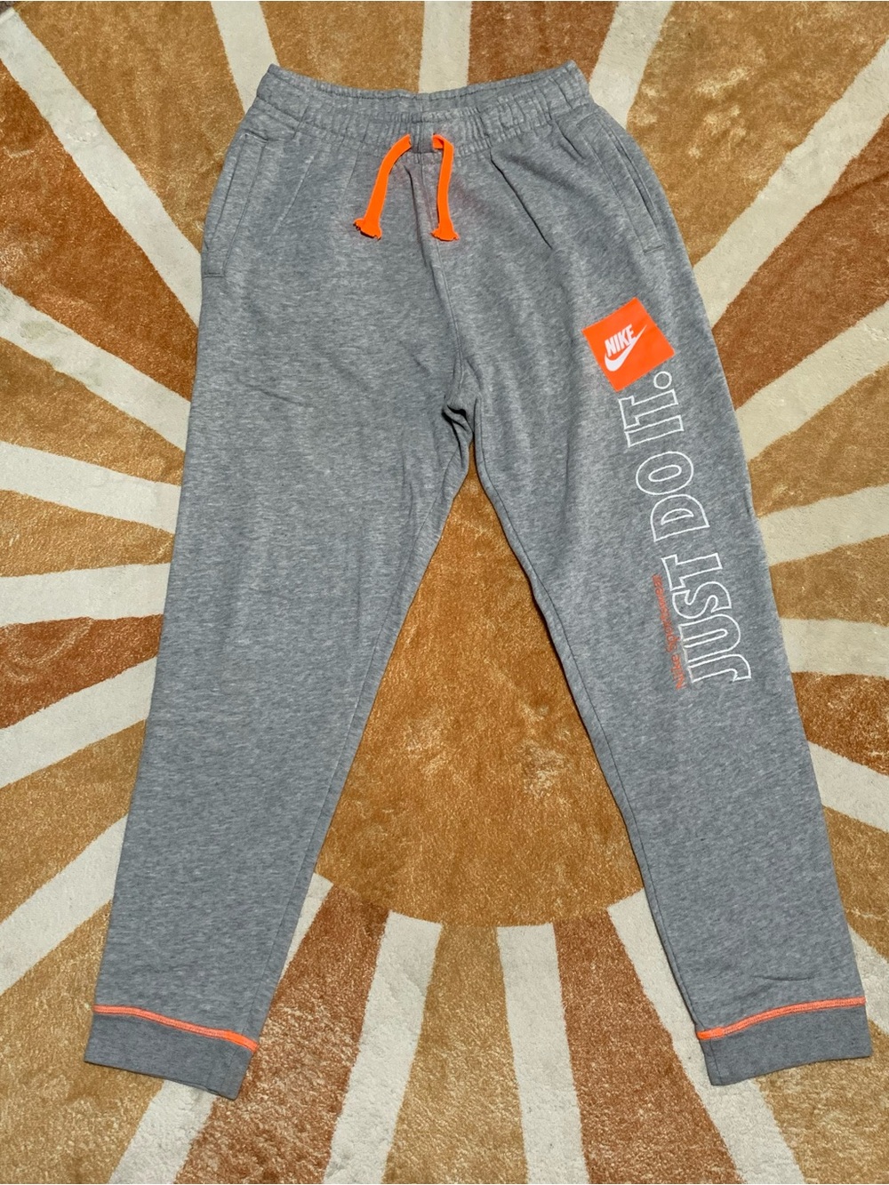 Nike Kids Gray Joggers with Bright Orange Accents